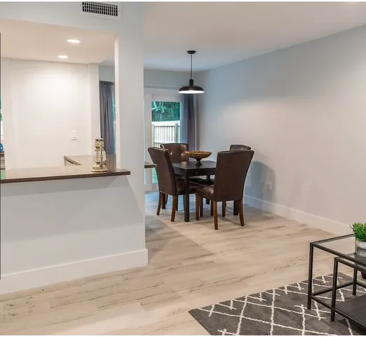 a bedroom with bed and painting on the wall