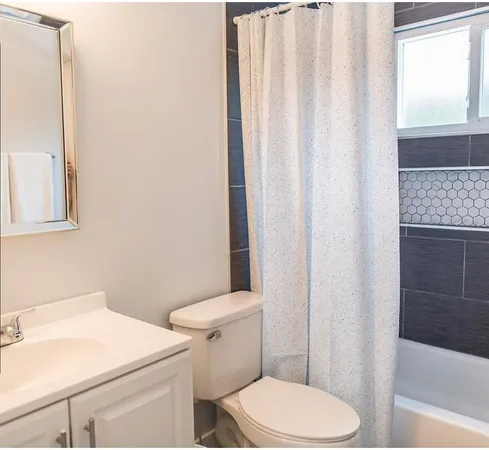 an aerial view of residential houses and city street