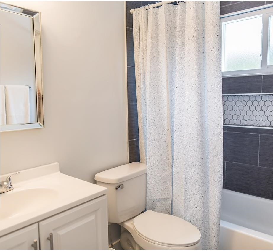 112 E Street St. Augustine, FL 32080 - Photo 31 of 41 a white toilet sitting next to a bathroom sink