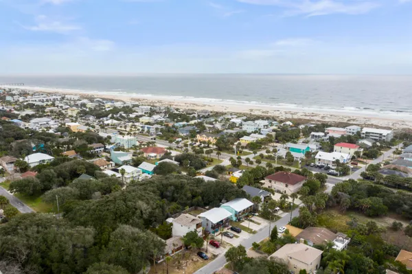 an aerial view of residential building with green space