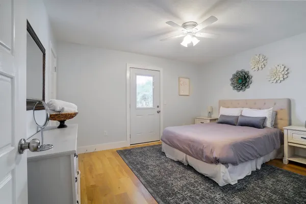 a bedroom with a bed and a chandelier