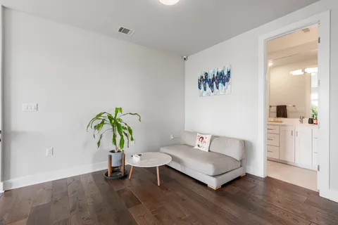 a living room with furniture and a bathtub