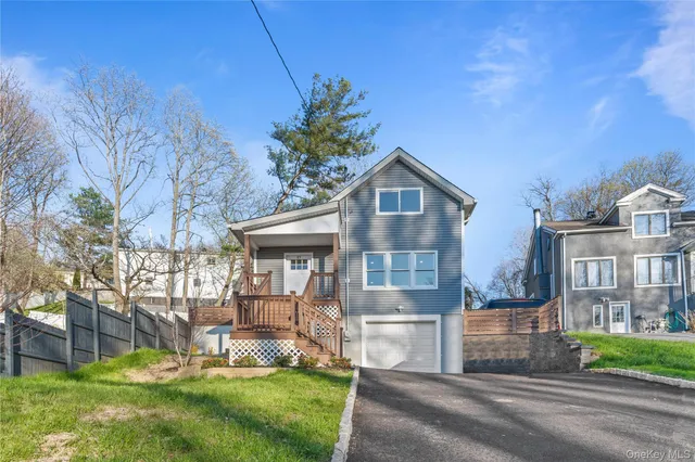 a view of house with a yard