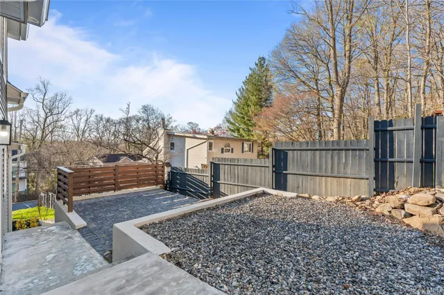 a view of a backyard with large trees