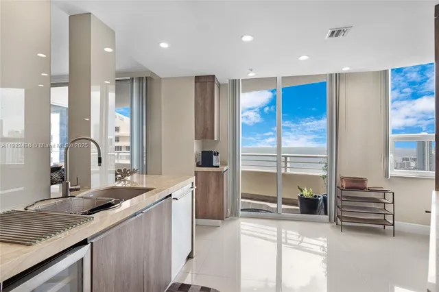 a kitchen with a sink and a refrigerator