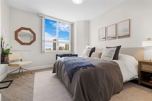 a bed room with a bed and a window