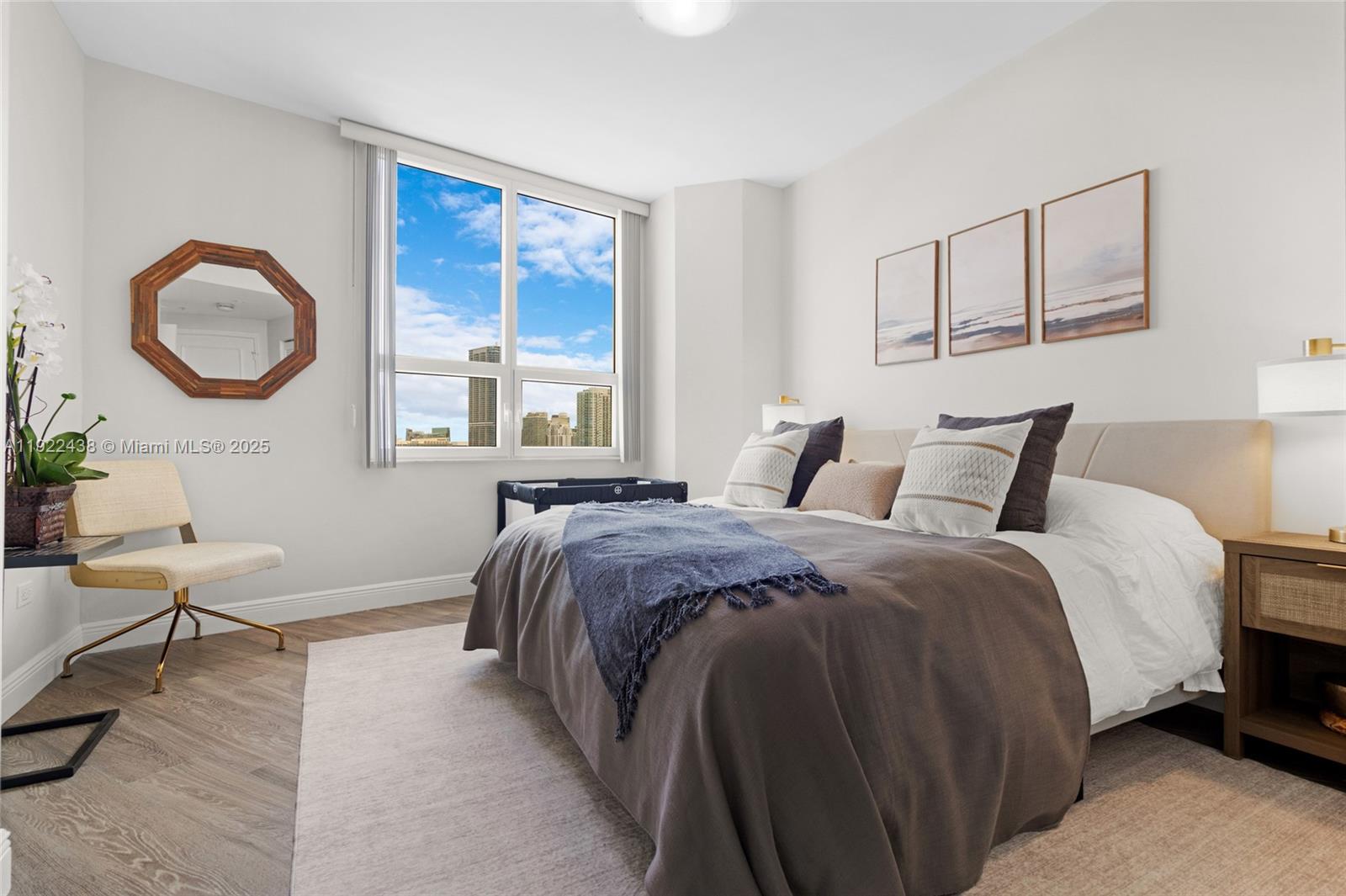 848 Brickell Key Drive, Unit 3905 Miami, FL 33131 - Photo 17 of 47 a bed room with a bed and a window