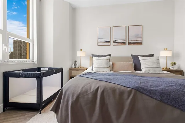 a bedroom with a bed and window