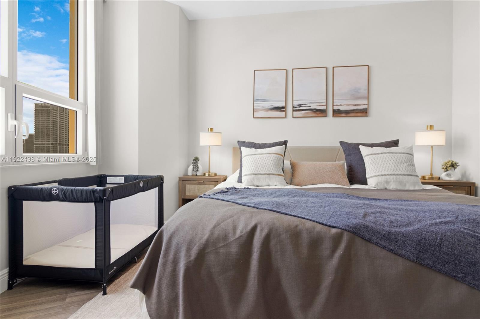 848 Brickell Key Drive, Unit 3905 Miami, FL 33131 - Photo 18 of 47 a bedroom with a bed and window