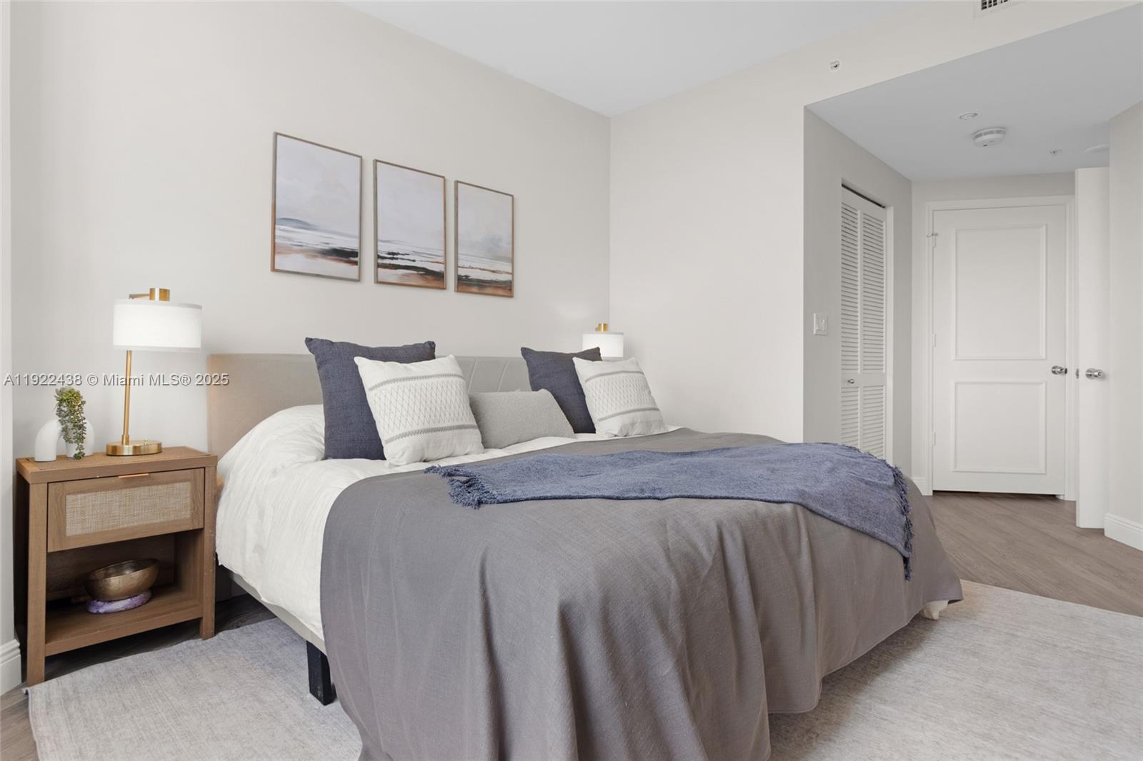 848 Brickell Key Drive, Unit 3905 Miami, FL 33131 - Photo 20 of 47 a bedroom with a bed and a night stand