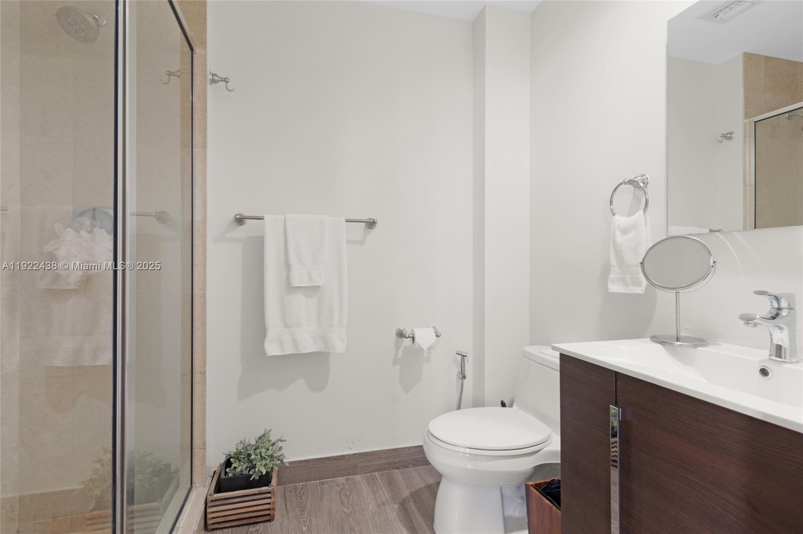 848 Brickell Key Drive, Unit 3905 Miami, FL 33131 - Photo 21 of 47 a bathroom with a sink toilet and shower