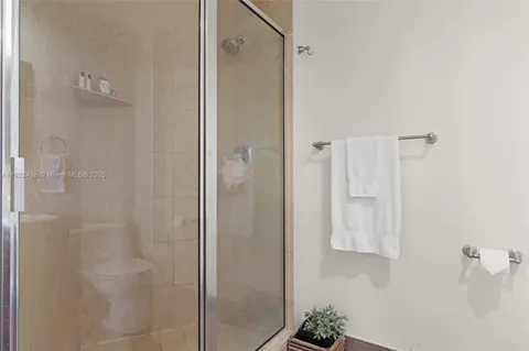 a bathroom with a shower and a sink