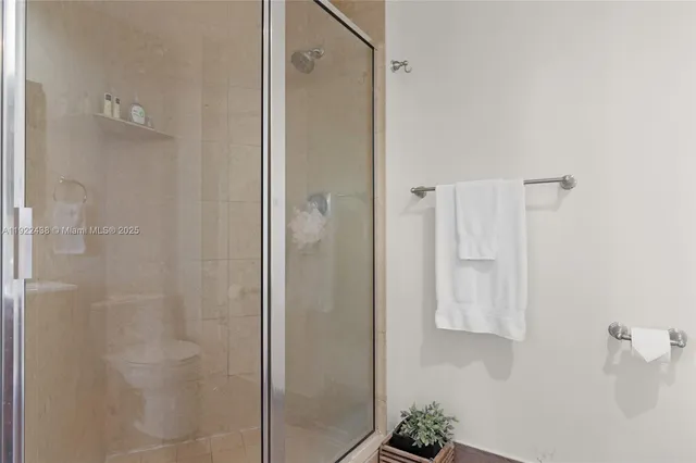 a bathroom with a shower and a sink