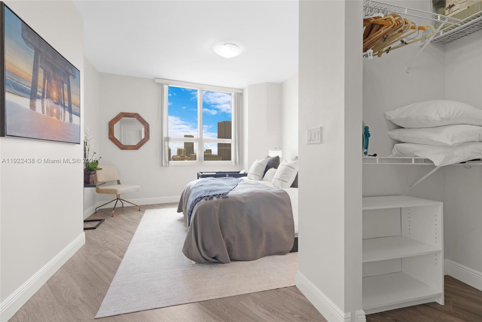 848 Brickell Key Drive, Unit 3905 Miami, FL 33131 - Photo 24 of 47 a bedroom with a bed and a window