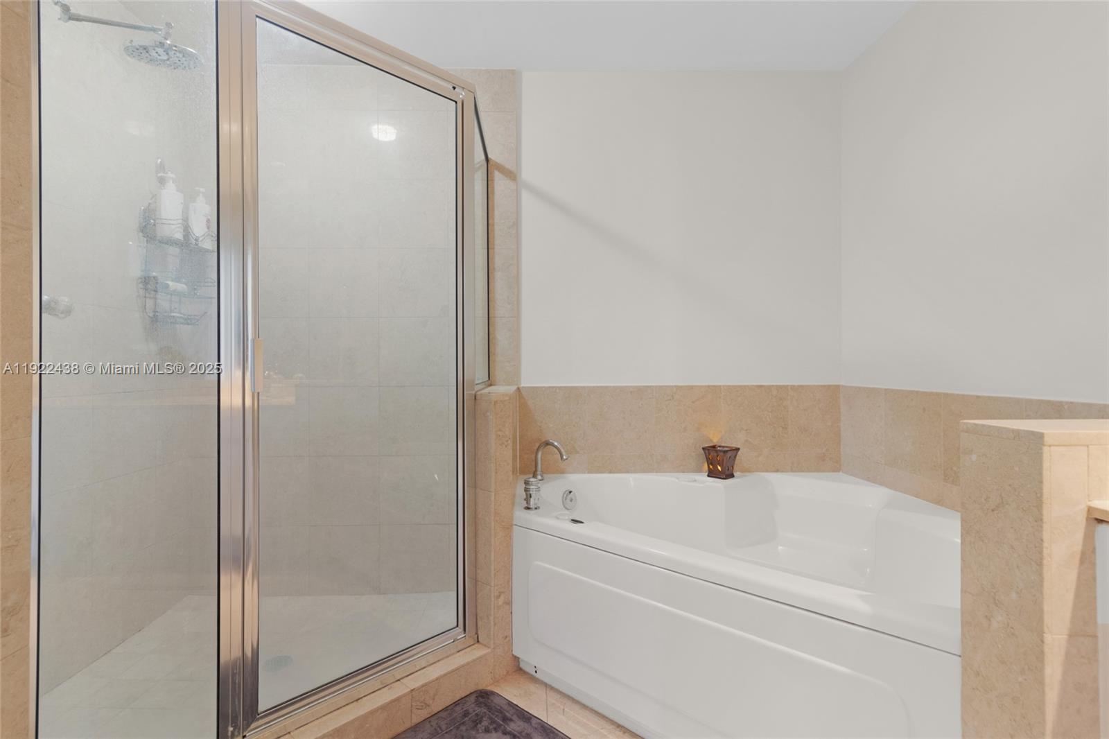 848 Brickell Key Drive, Unit 3905 Miami, FL 33131 - Photo 31 of 47 a bathroom with a bathtub