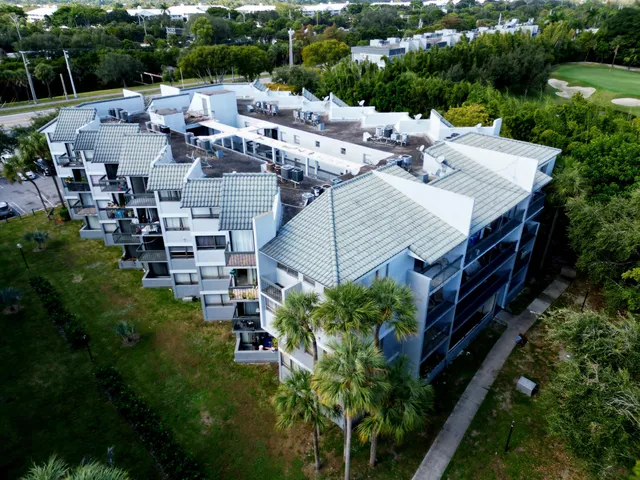 a view of a house with pool and garden