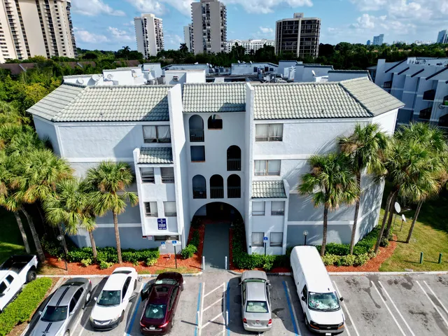 a view of a patio with table and chairs and potted plants