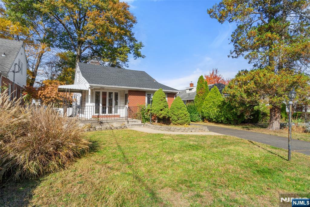 811 Summit Avenue Hackensack, NJ 07601 - Photo 1 of 26 a front view of a house with garden