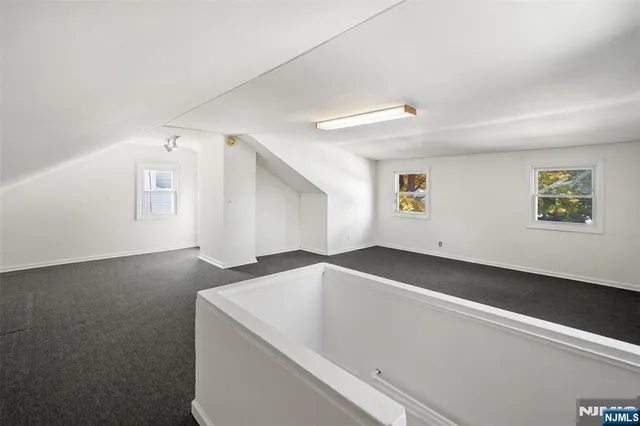 a view of an empty room with windows