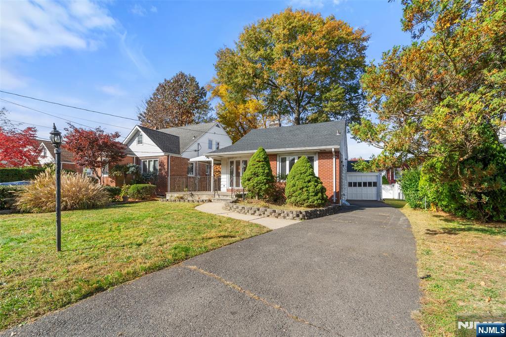 811 Summit Avenue Hackensack, NJ 07601 - Photo 2 of 26 a view of a house with a yard and potted plants