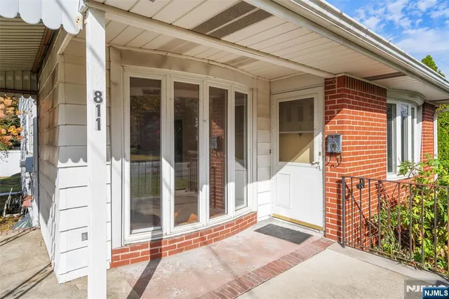 a view of backyard with porch