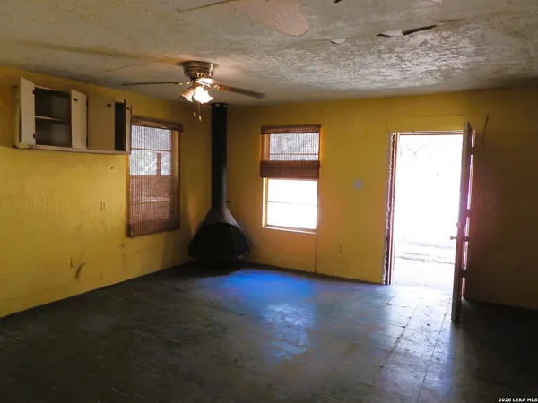a living room with hard wood floors