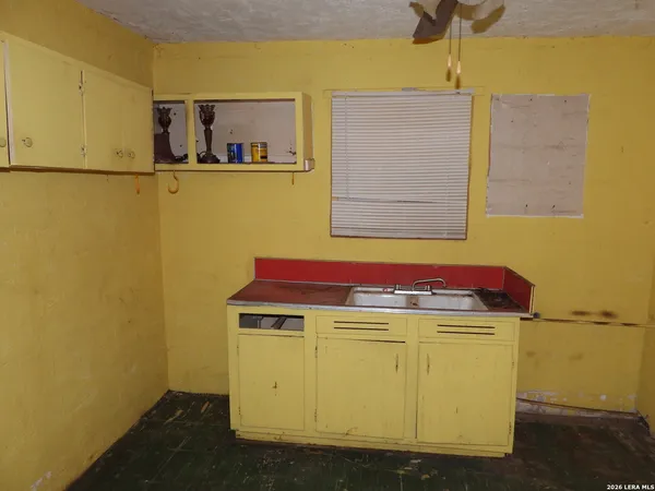 wooden floor in an empty room and a window