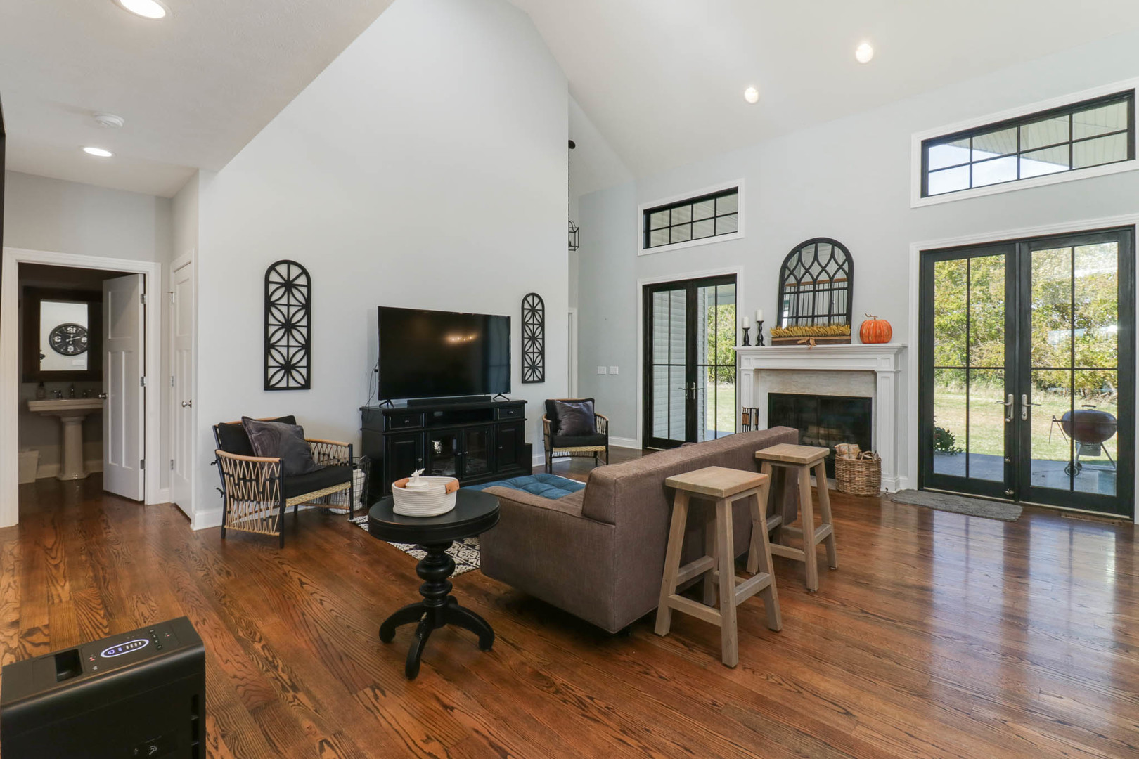 16658 North 200 East Road Danvers, IL 61732 - Photo 11 of 47 a living room with furniture a fireplace and a flat screen tv