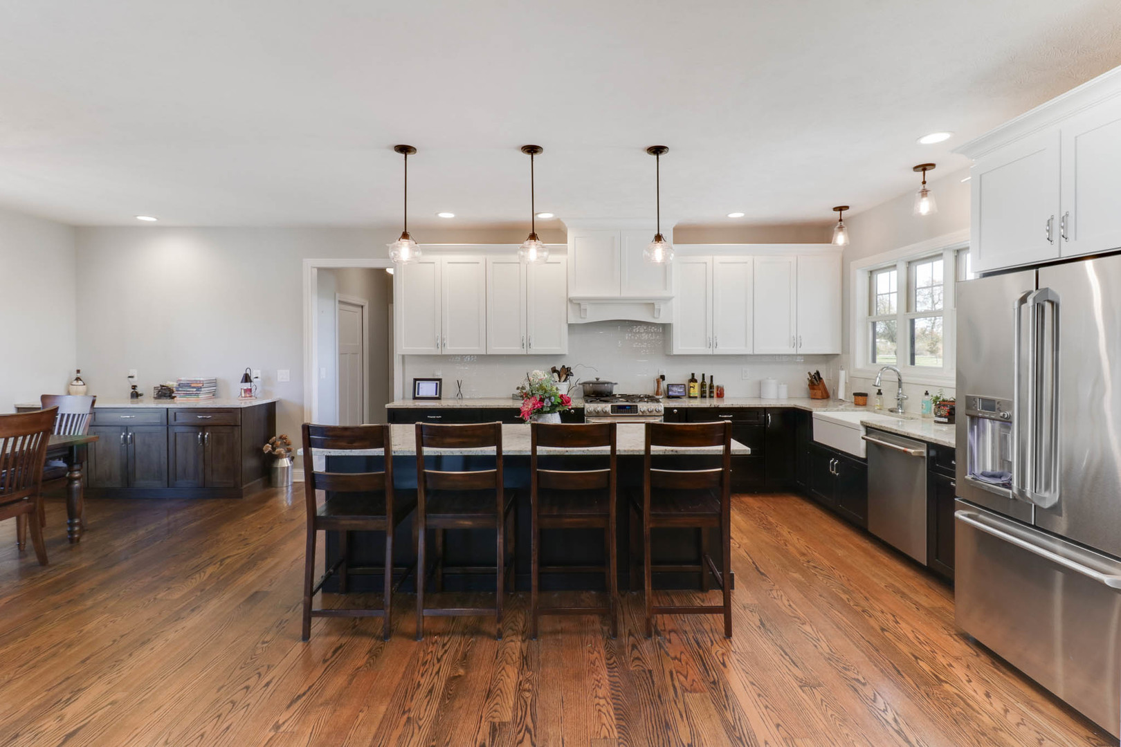 16658 North 200 East Road Danvers, IL 61732 - Photo 13 of 47 a kitchen with a table chairs stove and cabinets