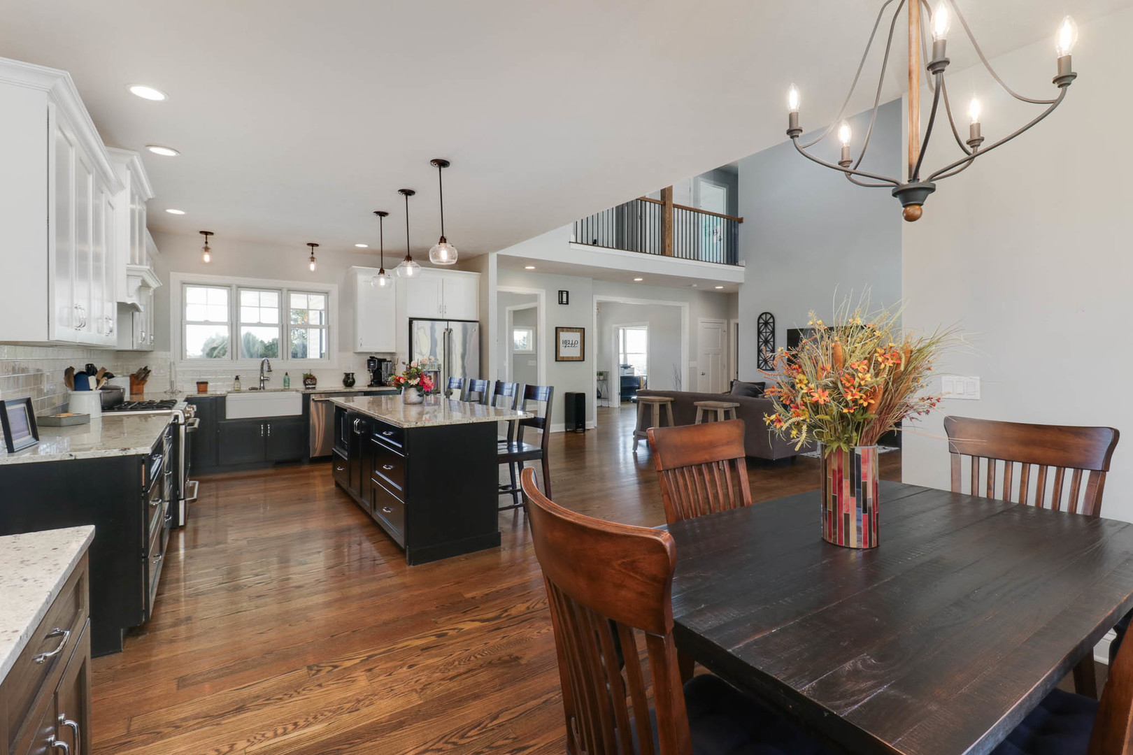16658 North 200 East Road Danvers, IL 61732 - Photo 18 of 47 a kitchen with stainless steel appliances granite countertop a table chairs and a chandelier