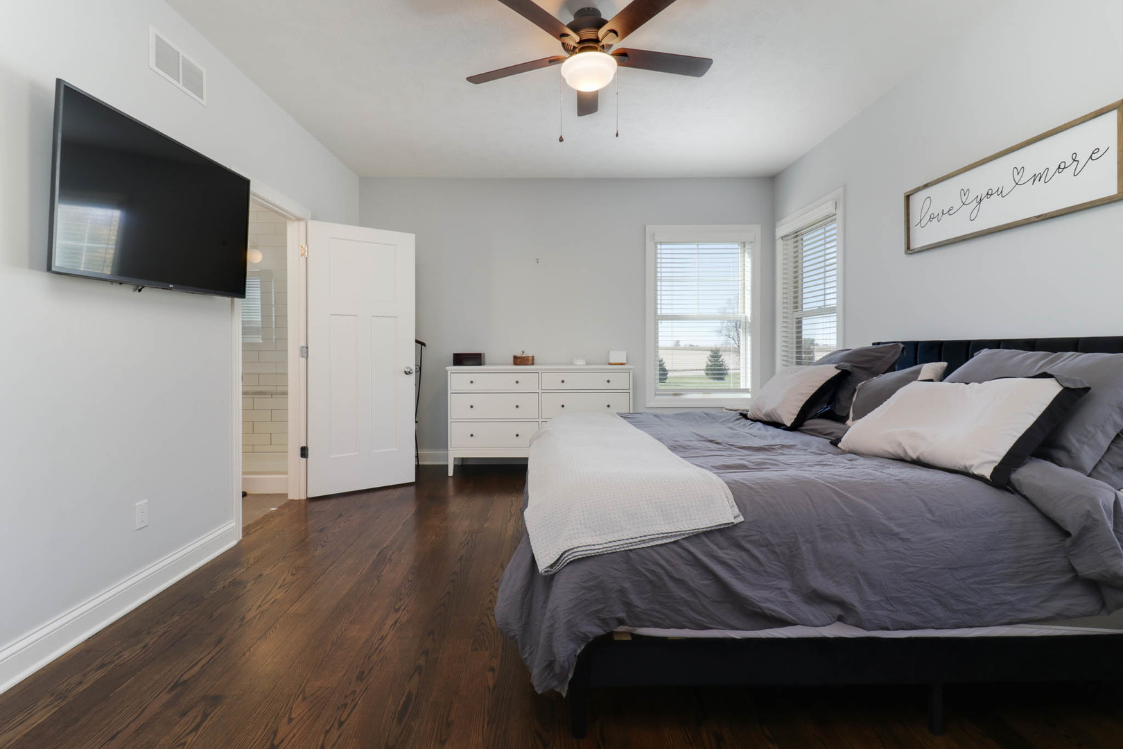 16658 North 200 East Road Danvers, IL 61732 - Photo 22 of 47 a bedroom with a bed and a flat screen tv