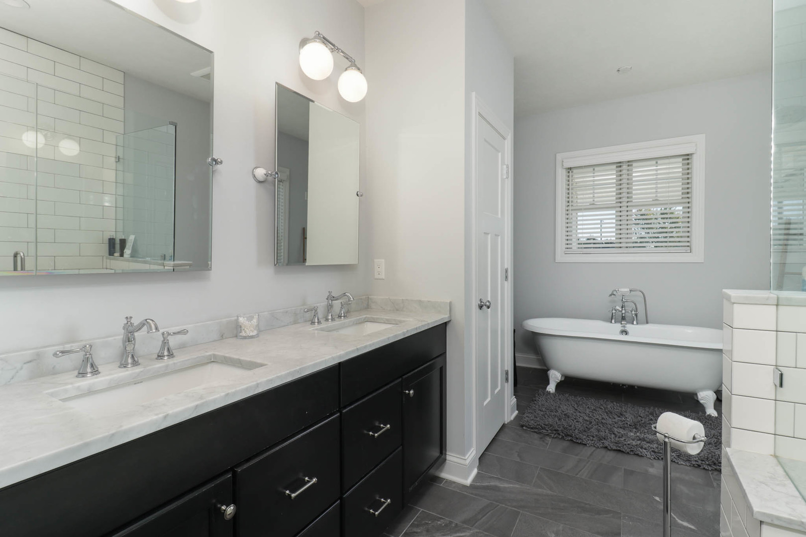 16658 North 200 East Road Danvers, IL 61732 - Photo 24 of 47 a spacious bathroom with a double vanity sink toilet mirror and bathtub