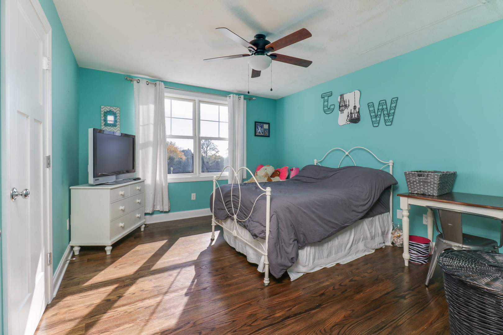 16658 North 200 East Road Danvers, IL 61732 - Photo 32 of 47 a bedroom with a bed a large window and wooden floor