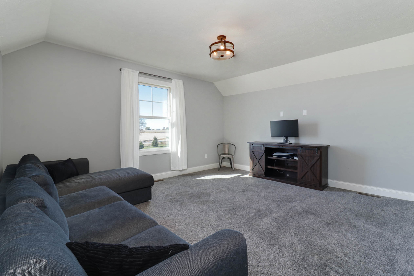 16658 North 200 East Road Danvers, IL 61732 - Photo 33 of 47 a living room with furniture and a flat screen tv