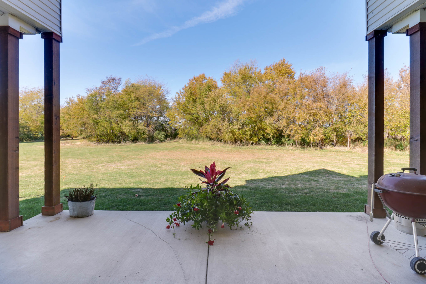 16658 North 200 East Road Danvers, IL 61732 - Photo 43 of 47 a view of a lake with a floor to ceiling window and a yard