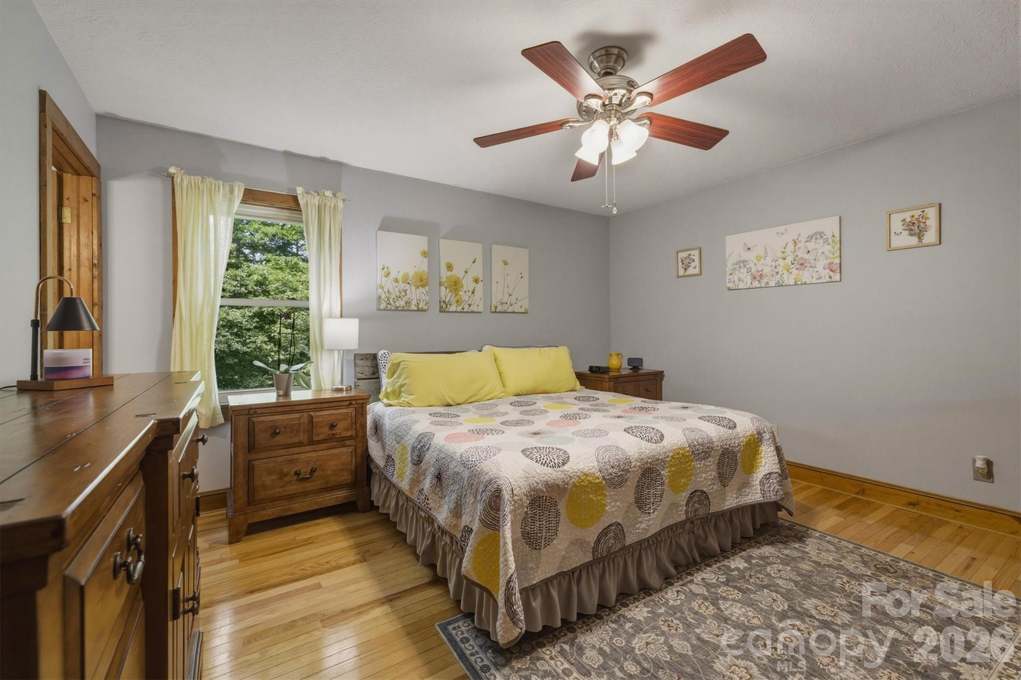 3432 Ridgewood Drive Morganton, NC 28655 - Photo 17 of 36 a bedroom with a bed and a chandelier