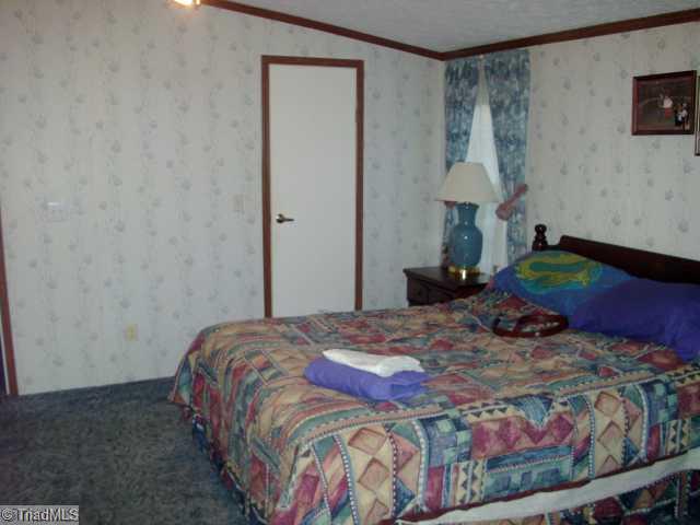 237 Atkinson Road Siloam, NC 27047 - Photo 10 of 16 Master Bedroom.