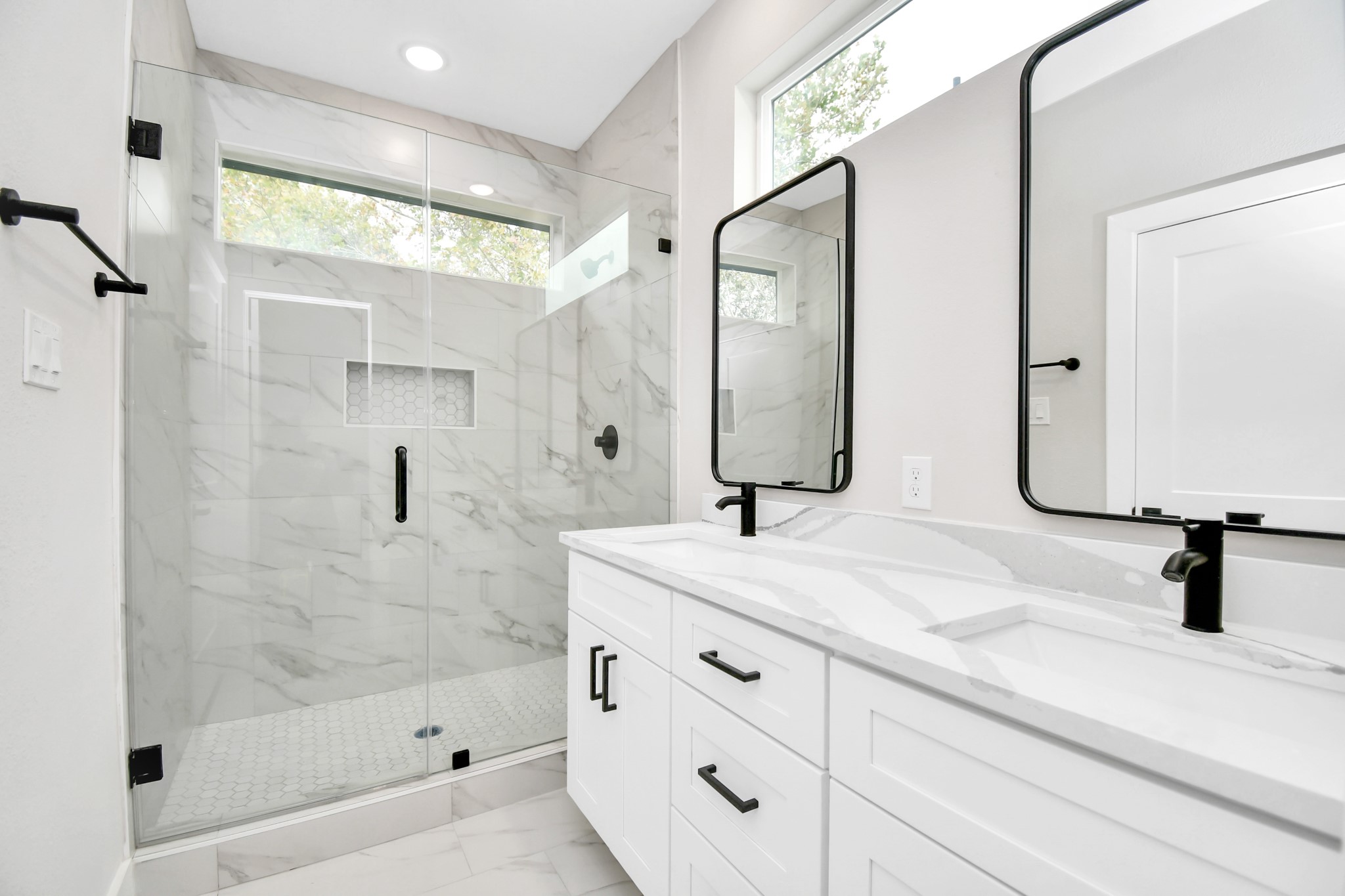 8409 Sunnyhill Street Houston, TX 77088 - Photo 10 of 13 a bathroom with a sink and a mirror