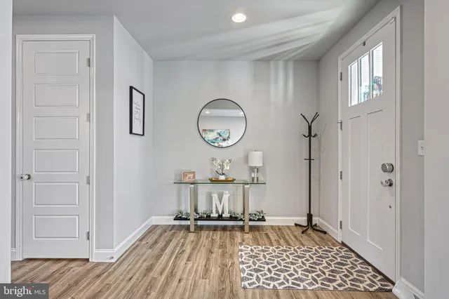 a bathroom with a toilet a sink and a window