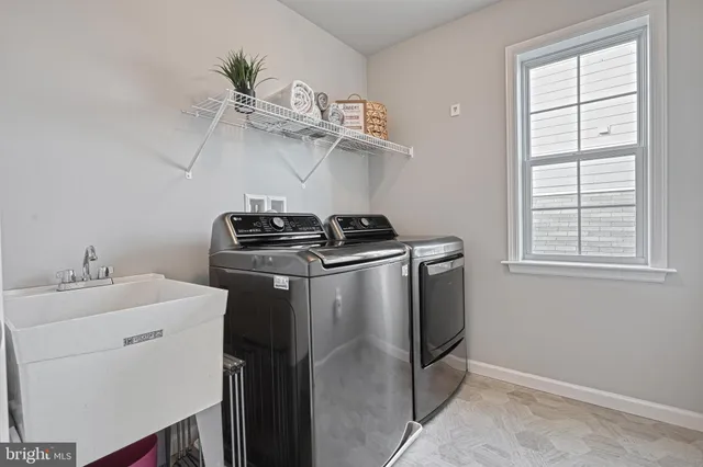 a view of a lake with a big yard and large trees