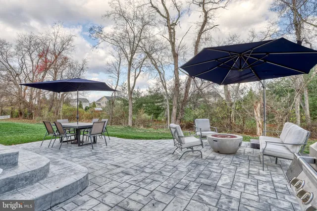 a view of a backyard with sitting area and furniture