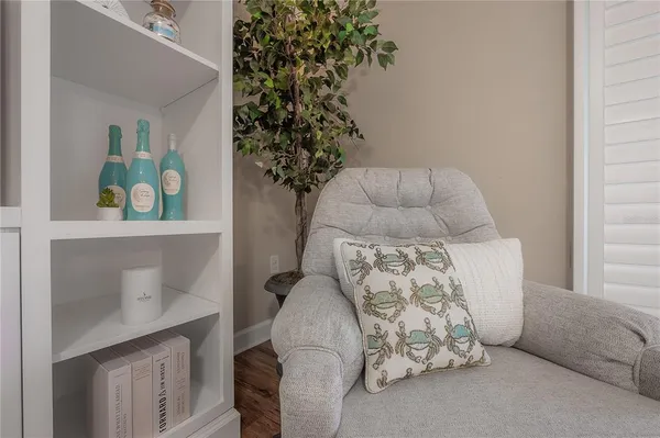 a bedroom with a bed and a potted plant