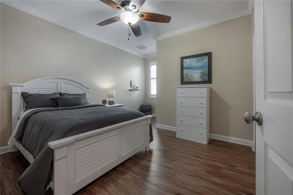 a view of a kitchen with wooden floor and a kitchen space