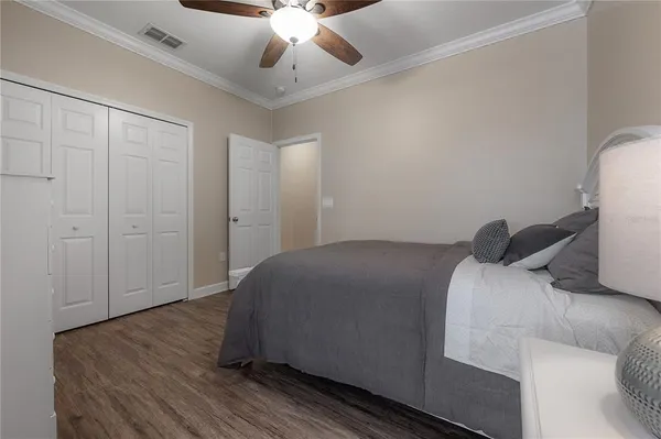 a bathroom with a granite countertop sink a toilet a mirror and bathtub
