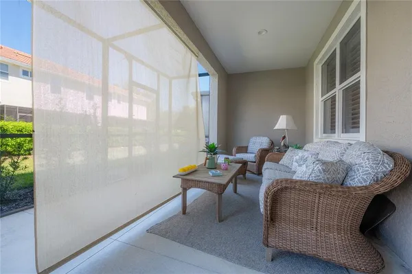 a view of a swimming pool and lounge chairs