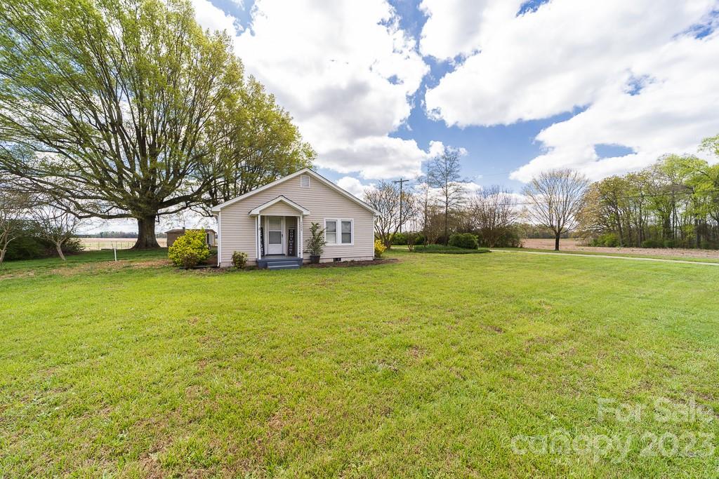 5204 Fish Road Marshville, NC 28103 - Photo 1 of 20 a view of a house with yard and garage