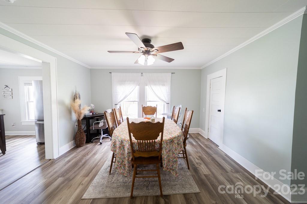 5204 Fish Road Marshville, NC 28103 - Photo 14 of 20 a dining room with furniture and wooden floor