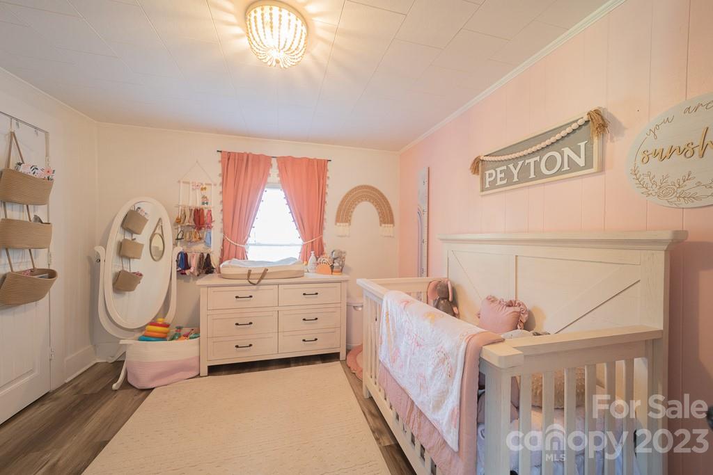5204 Fish Road Marshville, NC 28103 - Photo 17 of 20 a bedroom with a bed next to a window with the outer view