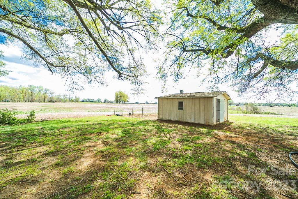 5204 Fish Road Marshville, NC 28103 - Photo 10 of 20 a view of yard with swimming pool and green space