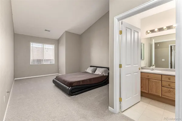 a living room with a bed and furniture